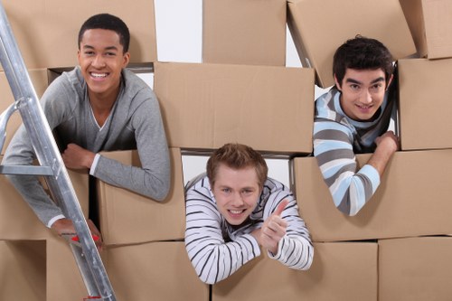 Packed boxes and furniture ready for urgent collection from a local Tolworth property