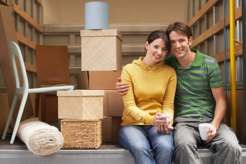 Removal team handling furniture and boxes during a local house move