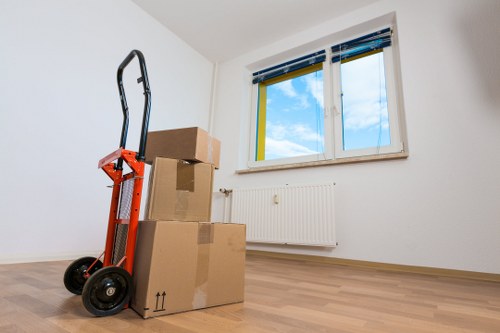 Professional movers handling desks and office furniture during a Tolworth relocation