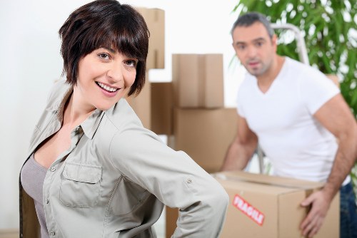 Unloading boxes and furniture at a new home near Tolworth